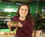 Dr. Alexis Noel holding a toad